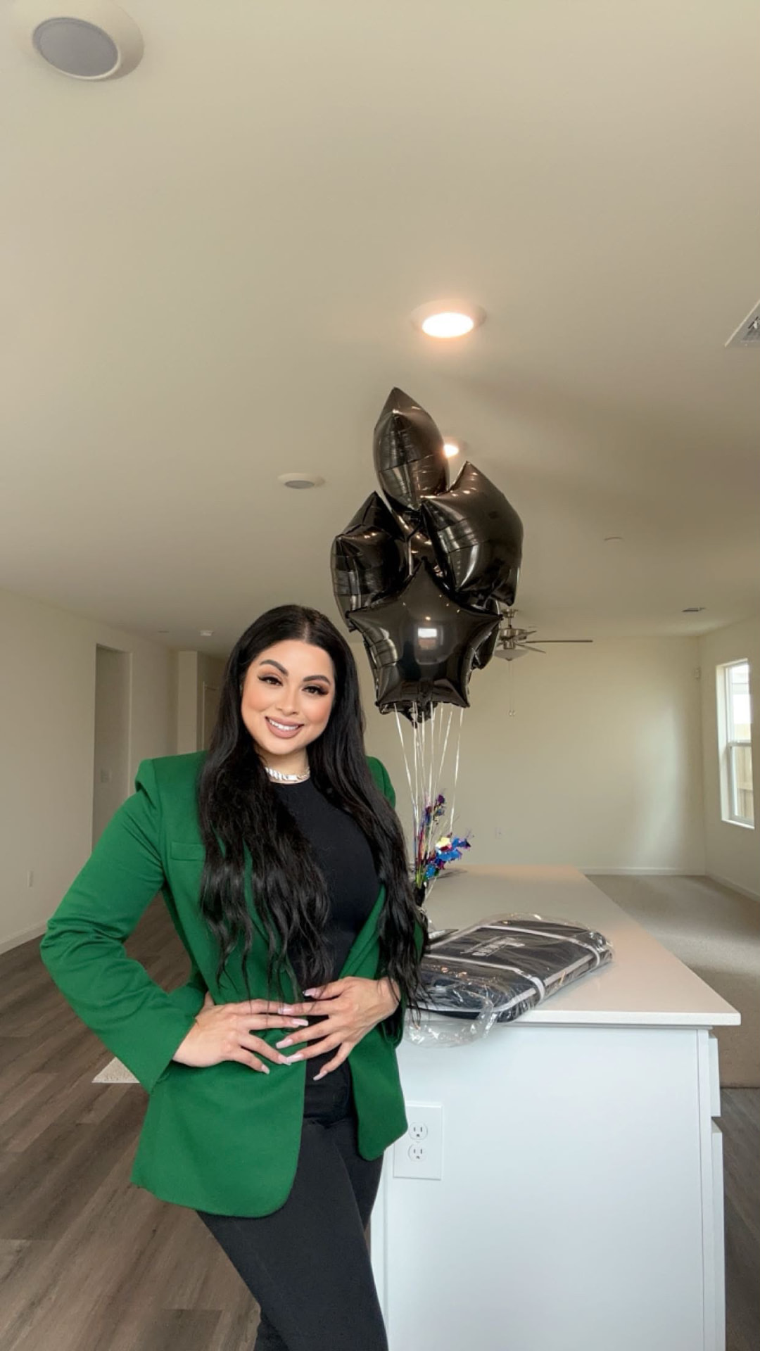 Taty Recinos celebrating a closing with balloons in a new Bakersfield home
