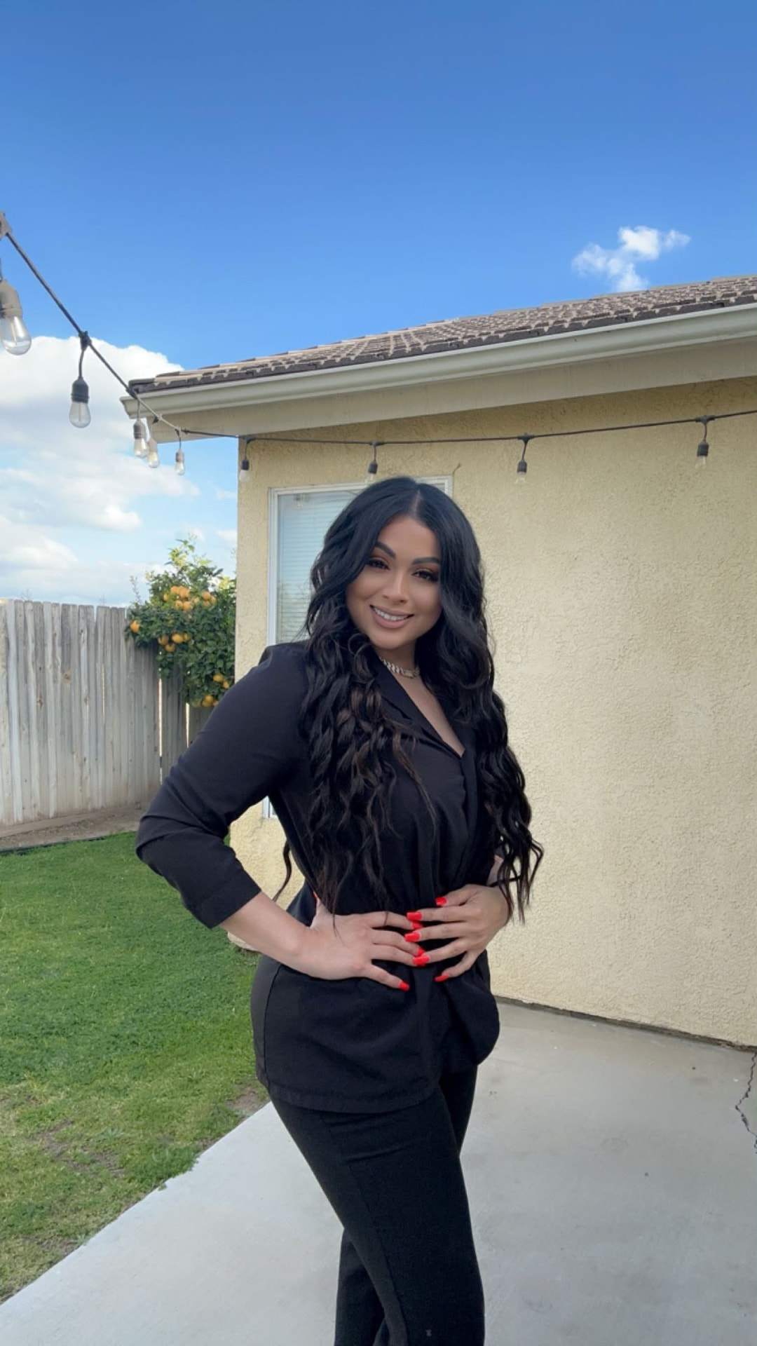 Taty Recinos outside a Bakersfield property