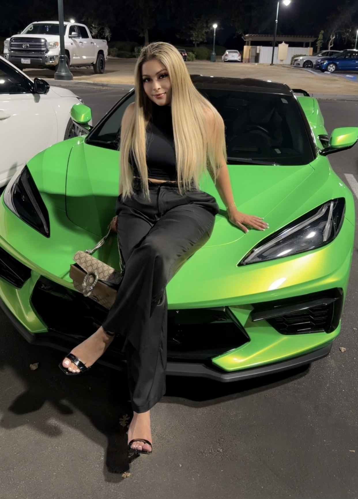 Taty Recinos with her car, representing her brand in Bakersfield, CA